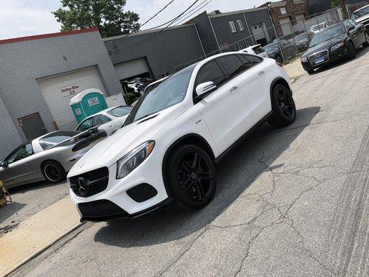 Custom matte white vinyl wrap and gloss black accents, with gloss black powder coated wheels.