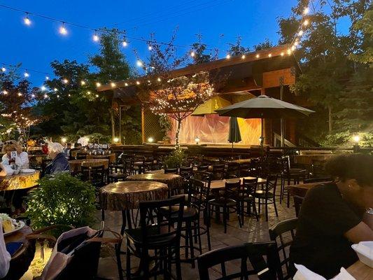 Outdoor patio with stage for live entertainment