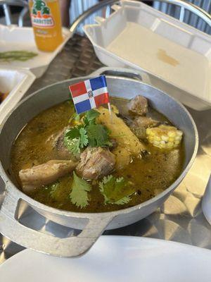 Some kind of Dominican soup with chicken, yucca, pork and corn. It was delicious