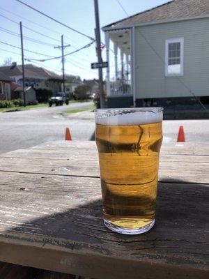 A cold pint of Harp,  decent solid bench to lounge on, and a random Union Jack.