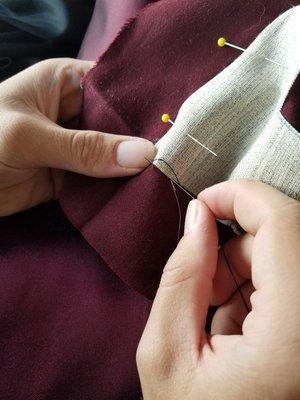 Hand stitched interfacing in a bespoke suit coat.