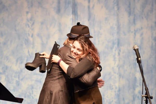 Casey thanks Patrick with a hug while accepting her award at the William Haralson Competition Winner's Gala.