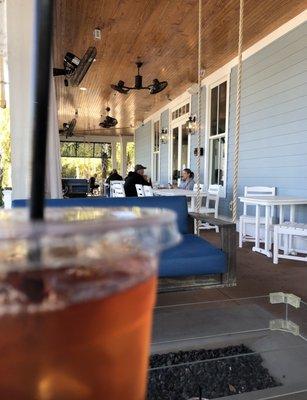 Ice Tea on the cool porch swings while you wait