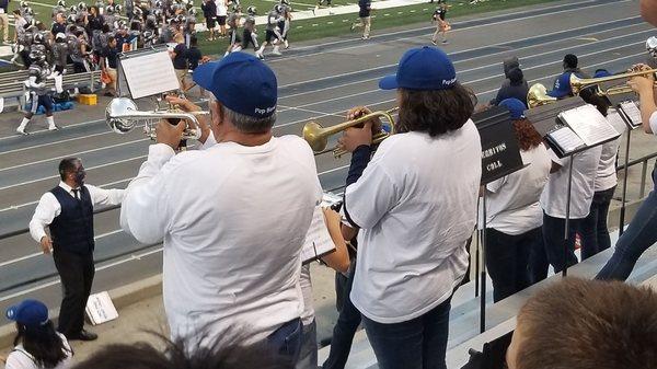 My dad and my daughter playing in the Pep Band.