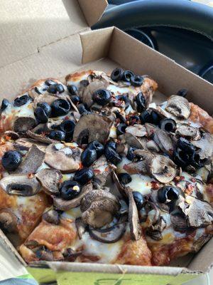 Personal Pizza with mushrooms and black olives.