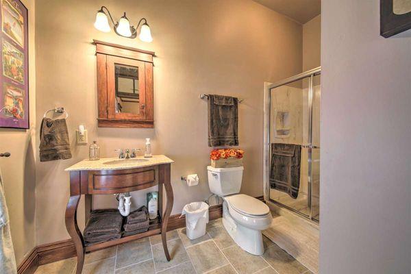 Healer Suite: private bathroom with luxurious shower, natural light, & laundry facilities.