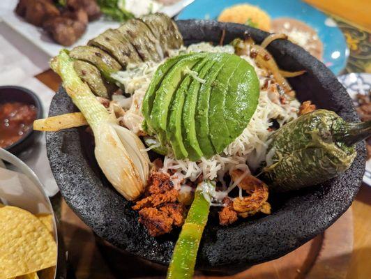 Classic molcajete (chorizo, shrimp, onions below, steak on the side)