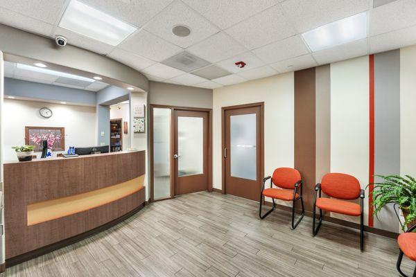 A modern and warm dental reception area at StarBrite Dental in Fremont, CA