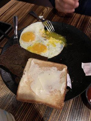 country breakfast (sunny side up eggs, white toast, scrapple)