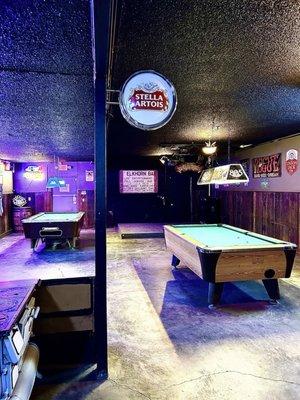 Two pool tables in the back room