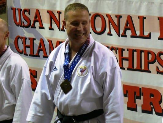 Shihan Buttermark after receiving 2nd Gold Medal of the 2013 USA-NKF National Championship.  At Greenville, SC - BI-LO Center.