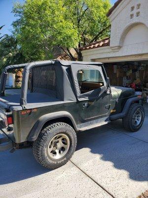 My beat up jeep and the sawed off wheel lock