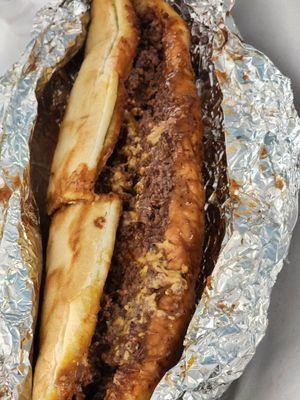 Steak and cheese with BBQ sauce on garlic bread