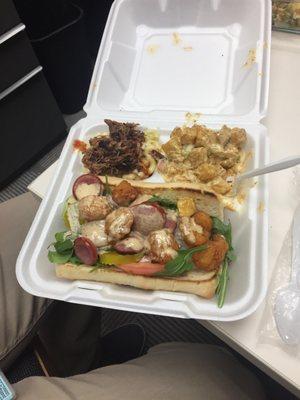 Shrimp po boy with a side of brisket Mac and cheese and fried potato salad