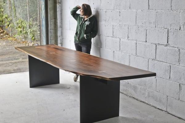 Black Walnut table top and steel panel leg base with blackened pantina.