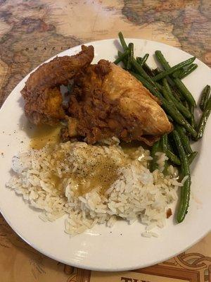 Fried chicken, rice with gravy and green beans.