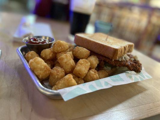 Buffalo Schnitzel Sandwich and tots