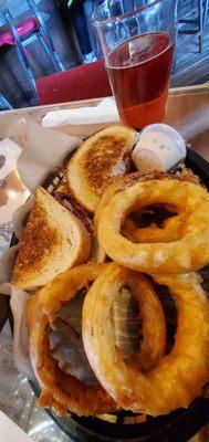 Reuben sandwich $12, added battered dipped onion rings $3.50, and 16oz Blake's hard cider $6