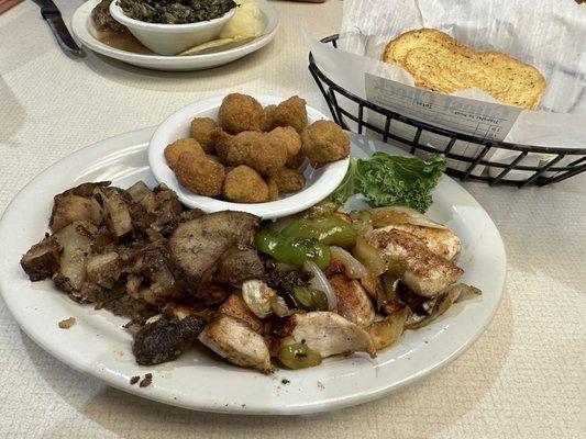 Grilled Chicken Tips with peppers and onions with Fried Okra and Texas Toast.