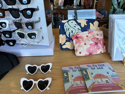 Sunglasses, books, cosmetic bags