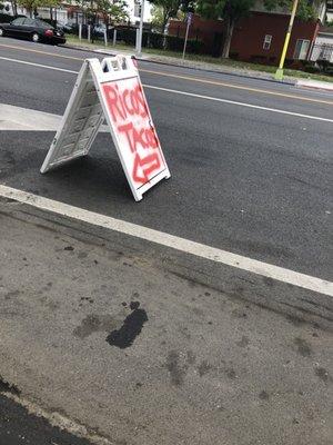 Signage in front of fence..