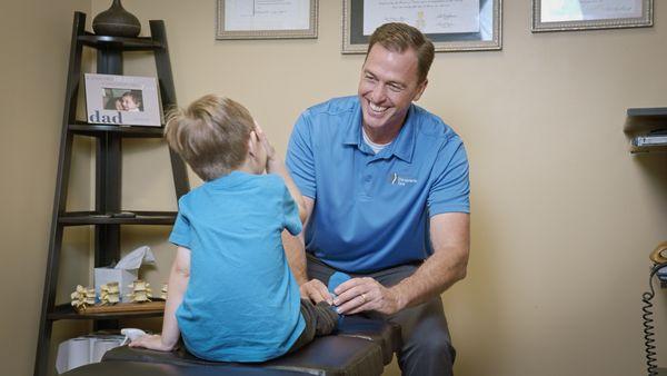 Dr. Stevens adjusting a pediatric patient.