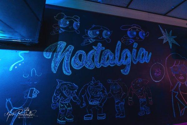 Custom chalk art wall inside Nostalgia