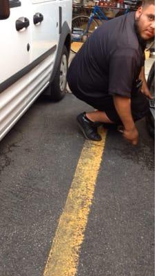 The parking attendant removing boot for $140! Checked with retailer if included in the vague "retailer" sign, boot!