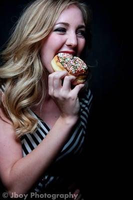 Customer enjoying her Raised Ring Donut