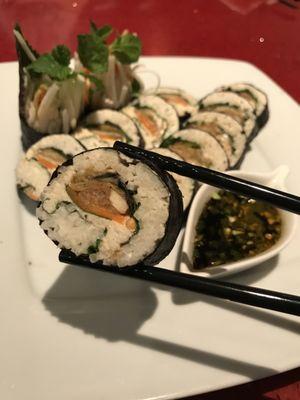 Our Living Foods Dragon Roll is a nutrient-rich and delicious vegan sushi. With cultured macadamia cheese and housemade kimchi.