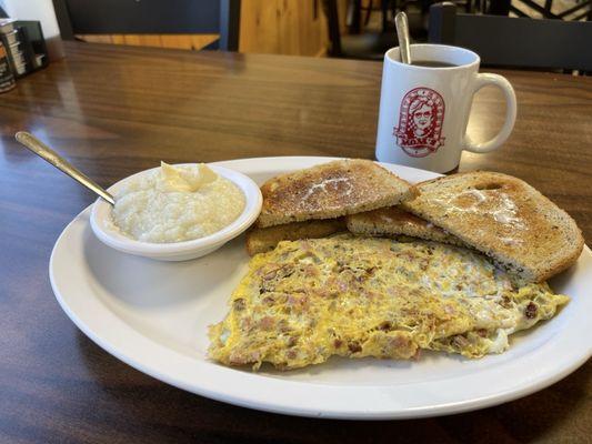 Meat omelette and grits with rye toast.