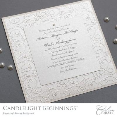 Candlelight Beginnings Album has classy invitations with a lot of details. This is more traditional.