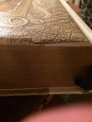 Top not glue and not put together properly. Glitter binding on sides and just unacceptable.