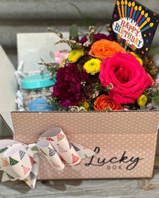 A fun birthday Lucky Box with a fresh bouquet paired with a sweet treat!