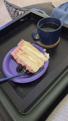 Vanilla cake with chocolate icing and blackberries on top