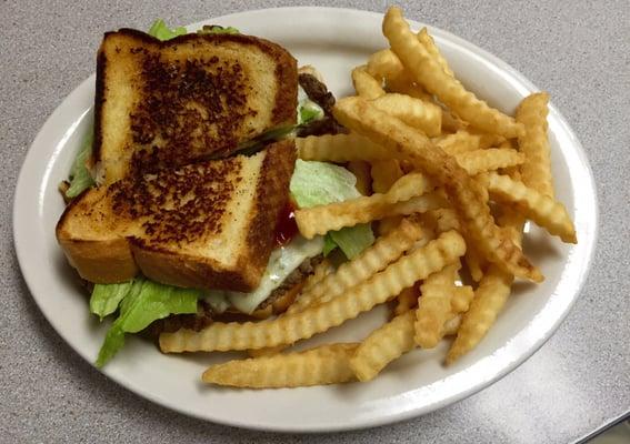 Riverside burger on garlic toast w/ pepper jack & bacon.