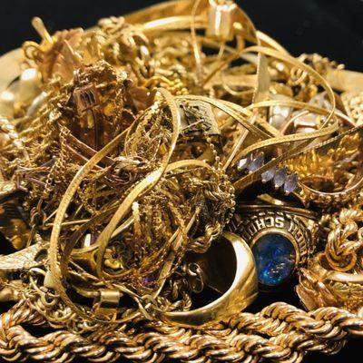 Pile of gold jewelry which is a combo of 10k, 14k and 18k. We buy gold jewelry.