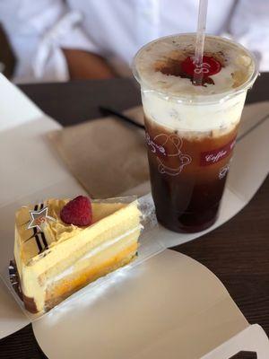 Mango brûlée cake and iced sea foam coffee. Highly recommend!