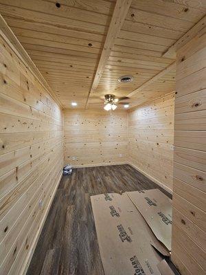 Bedroom build out in a basement, from concrete and studs to a hideaway cabin room!