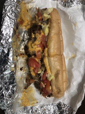 Philly with onions, mushrooms, lettuce, tomatoes, and cheez-wiz