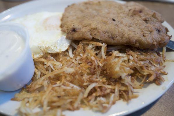 Chicken fried steak breakfast with over easy eggs