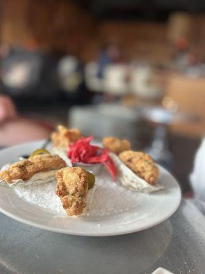 Cornmeal fried oysters with lemon aioli, pickled cabbage; and jalapeño