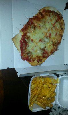 Jumbo slice of sausage and a order of cheese fries.