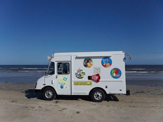 Ice cream truck selling ice cream on the beach!!  Cool!!