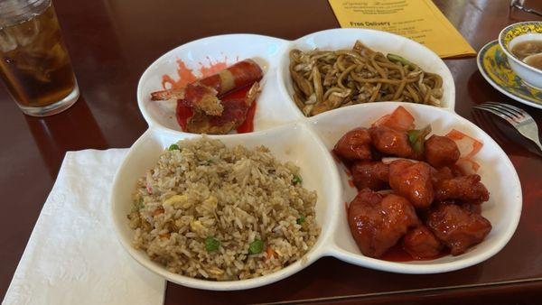 Special chicken fried rice, fried shrimp and egg roll, chicken chow main and pork sweet and sour and soup.