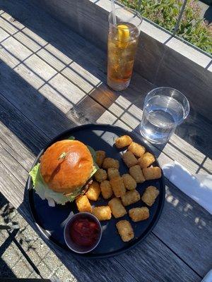 Smash Burger with tater tots and iced tea.