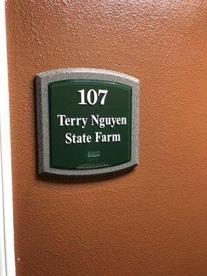 Front office sign: Suite 107.