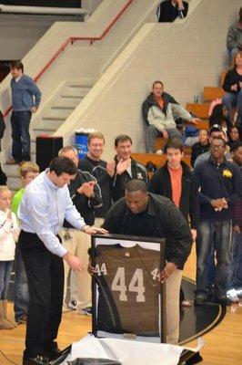 Jeremy Jarmon getting his number retired with former Mustang David Nugent present.