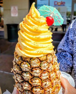 Pineapple smoothie with dole whip on top and tajin sprinkles