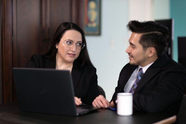 Lisa and Jonathan confer about a case